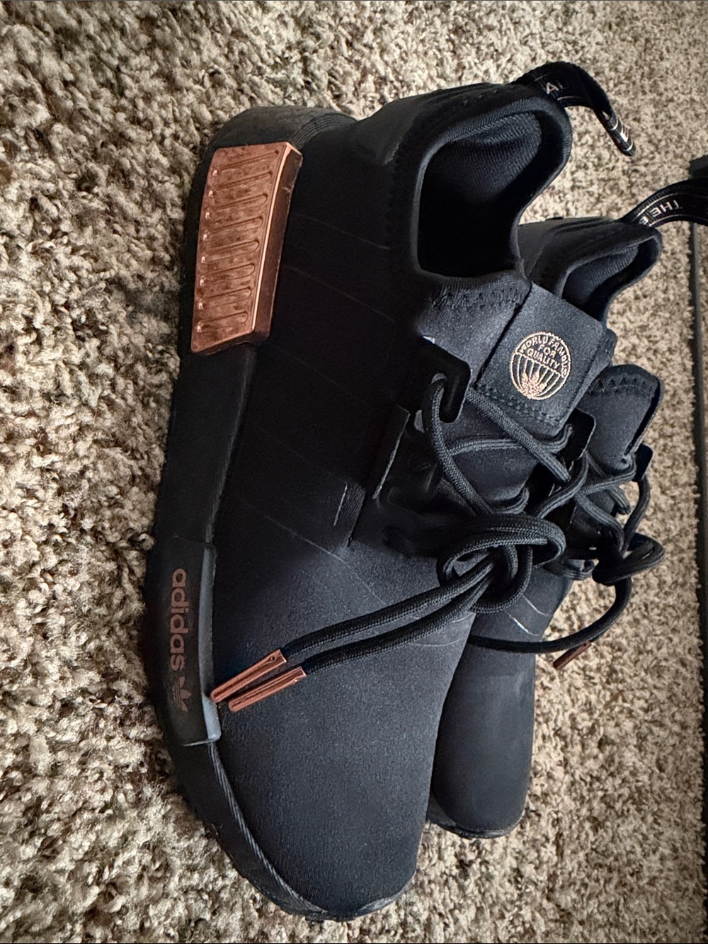 adidas NMD_R1 women’s Black Sneakers with Rose Gold Accents